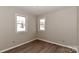 Bedroom features wood-look floors and a pair of double-hung windows at 2274 Old Wilkesboro Rd, Statesville, NC 28625
