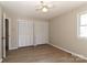 Bedroom with wood-look floors features built-in closets and a ceiling fan at 2274 Old Wilkesboro Rd, Statesville, NC 28625