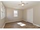 Neutral bedroom boasts a ceiling fan, wood-look flooring, and a double-door closet at 2274 Old Wilkesboro Rd, Statesville, NC 28625