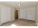 Bedroom boasts wood-look flooring and built-in closets adjacent to the bathroom at 2274 Old Wilkesboro Rd, Statesville, NC 28625