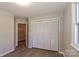 Bedroom offers wood-look floors and a double-door closet at 2274 Old Wilkesboro Rd, Statesville, NC 28625