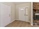 A welcoming entryway with light-colored walls, wood floors, and a stone fireplace visible at 2274 Old Wilkesboro Rd, Statesville, NC 28625