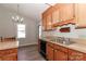 Eat-in kitchen with stainless steel sink and appliances, and wood cabinets at 2274 Old Wilkesboro Rd, Statesville, NC 28625