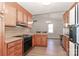 Well-lit kitchen with wood cabinets and eat-in dining area at 2274 Old Wilkesboro Rd, Statesville, NC 28625