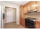 Functional kitchen featuring wooden cabinets and an electric range at 2274 Old Wilkesboro Rd, Statesville, NC 28625