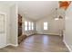 A bright living room features wood floors, a stone fireplace, and natural light streaming through windows at 2274 Old Wilkesboro Rd, Statesville, NC 28625