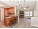 Open-concept living area with kitchen, stone fireplace, and large windows at 2274 Old Wilkesboro Rd, Statesville, NC 28625