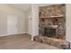 Cozy living room featuring a stone fireplace and modern flooring at 2274 Old Wilkesboro Rd, Statesville, NC 28625