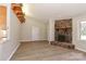 Bright open living room with stone fireplace, hardwood floors, and open access to the entryway at 2274 Old Wilkesboro Rd, Statesville, NC 28625