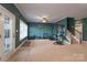 Basement area with exercise equipment, a window, and door to the exterior at 228 Black Mountain Dr, Fort Mill, SC 29708