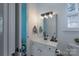 Bright bathroom with white vanity, modern fixtures, and a large mirror with decorative lighting at 228 Black Mountain Dr, Fort Mill, SC 29708