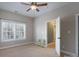 Bright bedroom with a ceiling fan, a large window and neutral colored walls at 228 Black Mountain Dr, Fort Mill, SC 29708