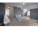 Spacious bonus room with neutral paint, carpeted floor and a slide play area, great for recreation at 228 Black Mountain Dr, Fort Mill, SC 29708