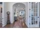 Inviting foyer with hardwood floors, archway, decorative rug and elegant furniture at 228 Black Mountain Dr, Fort Mill, SC 29708