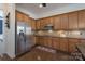 Spacious kitchen featuring stainless steel appliances, plenty of wooden cabinets, and granite countertops at 228 Black Mountain Dr, Fort Mill, SC 29708