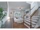 Spacious living room with fireplace, built-in shelves, and staircase in background at 228 Black Mountain Dr, Fort Mill, SC 29708