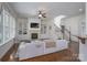 Spacious living room featuring a fireplace, built-in shelves, and staircase at 228 Black Mountain Dr, Fort Mill, SC 29708