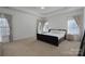 Spacious main bedroom with soft carpet, tray ceilings, and large windows offering plenty of light at 228 Black Mountain Dr, Fort Mill, SC 29708