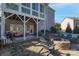 Covered patio featuring an outdoor fire pit and seating area at 228 Black Mountain Dr, Fort Mill, SC 29708