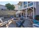 Patio features outdoor firepit with comfortable seating and sunroom at 228 Black Mountain Dr, Fort Mill, SC 29708