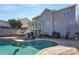 Back exterior view of home featuring a pool with an outdoor seating area and sunroom at 228 Black Mountain Dr, Fort Mill, SC 29708
