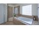 Bathroom featuring a glass enclosed walk-in shower and soaking tub with tile surround at 228 Black Mountain Dr, Fort Mill, SC 29708