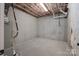 Unfinished basement with concrete flooring and exposed ceiling, ready to be customized at 228 Black Mountain Dr, Fort Mill, SC 29708