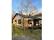 A compact home with a mix of classic siding and dark trim at 233 Poag St, Rock Hill, SC 29730
