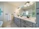 Bright bathroom with double vanity, quartz countertop, and stylish tile backsplash at 2501 Tanglewood Ln, Charlotte, NC 28211