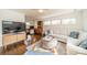 Cozy living room features a comfortable sofa, media cabinet, and plenty of natural light at 2501 Tanglewood Ln, Charlotte, NC 28211