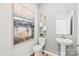 Cozy bathroom with wooden floors, toilet, modern sink and art decoration at 298 Bezelle Ave, York, SC 29745