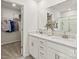 Bright bathroom features a dual sink vanity with white cabinets and a large mirror at 298 Bezelle Ave, York, SC 29745