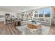 Bright living room featuring modern sofas, a decorative coffee table and large windows at 298 Bezelle Ave, York, SC 29745