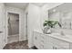 Bright bathroom featuring a double sink vanity, modern fixtures, and a walk-in closet for ample storage at 302 Bezelle Ave, York, SC 29745