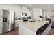 Bright kitchen with stainless steel appliances, granite counters, and bar seating at 302 Bezelle Ave, York, SC 29745