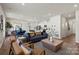 Open living area with modern furnishings, wood floors, and seamless flow into the kitchen at 302 Bezelle Ave, York, SC 29745