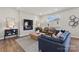 Comfortable living room with modern furniture, a fireplace, and natural light from the large window at 302 Bezelle Ave, York, SC 29745