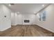 Open-concept living room featuring an electric fireplace, recessed lights and wood flooring at 302 Bezelle Ave, York, SC 29745