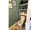 Cozy bathroom with toilet, small shelving, and modern decor at 329 Aniston Ln, Shelby, NC 28152