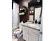 Contemporary bathroom with a shower-tub combo, granite vanity, and dark wall paint at 329 Aniston Ln, Shelby, NC 28152