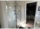 Modern bathroom featuring a glass enclosed shower and a glimpse into the walk-in closet at 329 Aniston Ln, Shelby, NC 28152