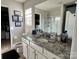 Well-lit bathroom with granite counters, under sink storage, and a walk-in shower at 329 Aniston Ln, Shelby, NC 28152