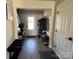 Bright entryway featuring modern decor, coat rack, bench, and neutral flooring at 329 Aniston Ln, Shelby, NC 28152