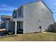 The side exterior of the house shows the vinyl siding and well-maintained lawn at 329 Aniston Ln, Shelby, NC 28152