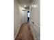 Hallway featuring carpeted floors, access to rooms, and convenient linen closet at 329 Aniston Ln, Shelby, NC 28152