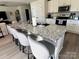 Open kitchen with granite island, bar seating and stainless steel sink at 329 Aniston Ln, Shelby, NC 28152