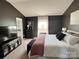 Spacious main bedroom with dark walls, a king-size bed and dark furniture at 329 Aniston Ln, Shelby, NC 28152