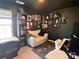 Cozy office space with decorative book shelve, wall art, and modern work station at 329 Aniston Ln, Shelby, NC 28152