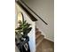 Carpeted staircase with dark wood railing, leading to the upper level of the home at 329 Aniston Ln, Shelby, NC 28152