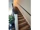 Carpeted staircase with dark wood railing, leading to the upper level of the home at 329 Aniston Ln, Shelby, NC 28152